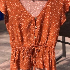 Women’s orange polka dot blouse